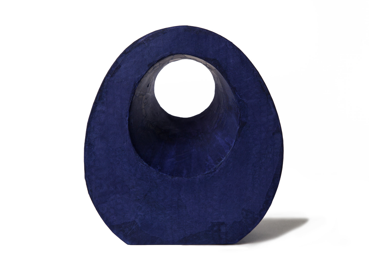 Picture of a beautiful purple tear drop shaped biodegradable paper cremation urn on sale at Muses Design Urns. Front view.