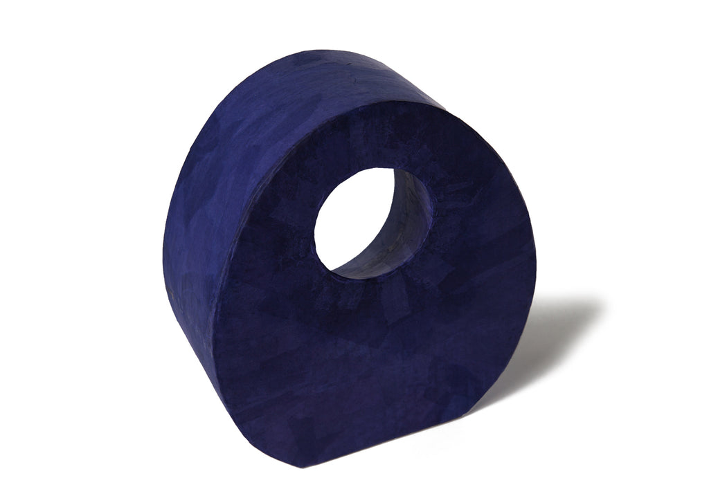 Picture of a beautiful purple tear drop shaped biodegradable paper cremation urn on sale at Muses Design Urns. Back view.