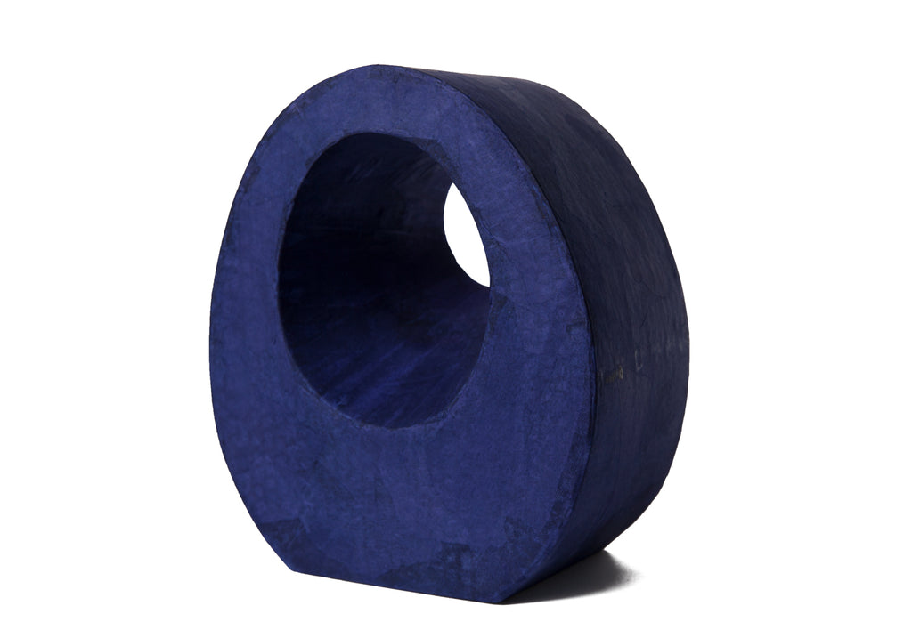 Picture of a beautiful purple tear drop shaped biodegradable paper cremation urn on sale at Muses Design Urns. Left side view.