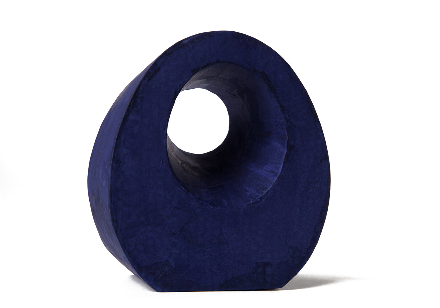 Picture of a beautiful purple tear drop shaped biodegradable paper cremation urn on sale at Muses Design Urns. Right side view.
