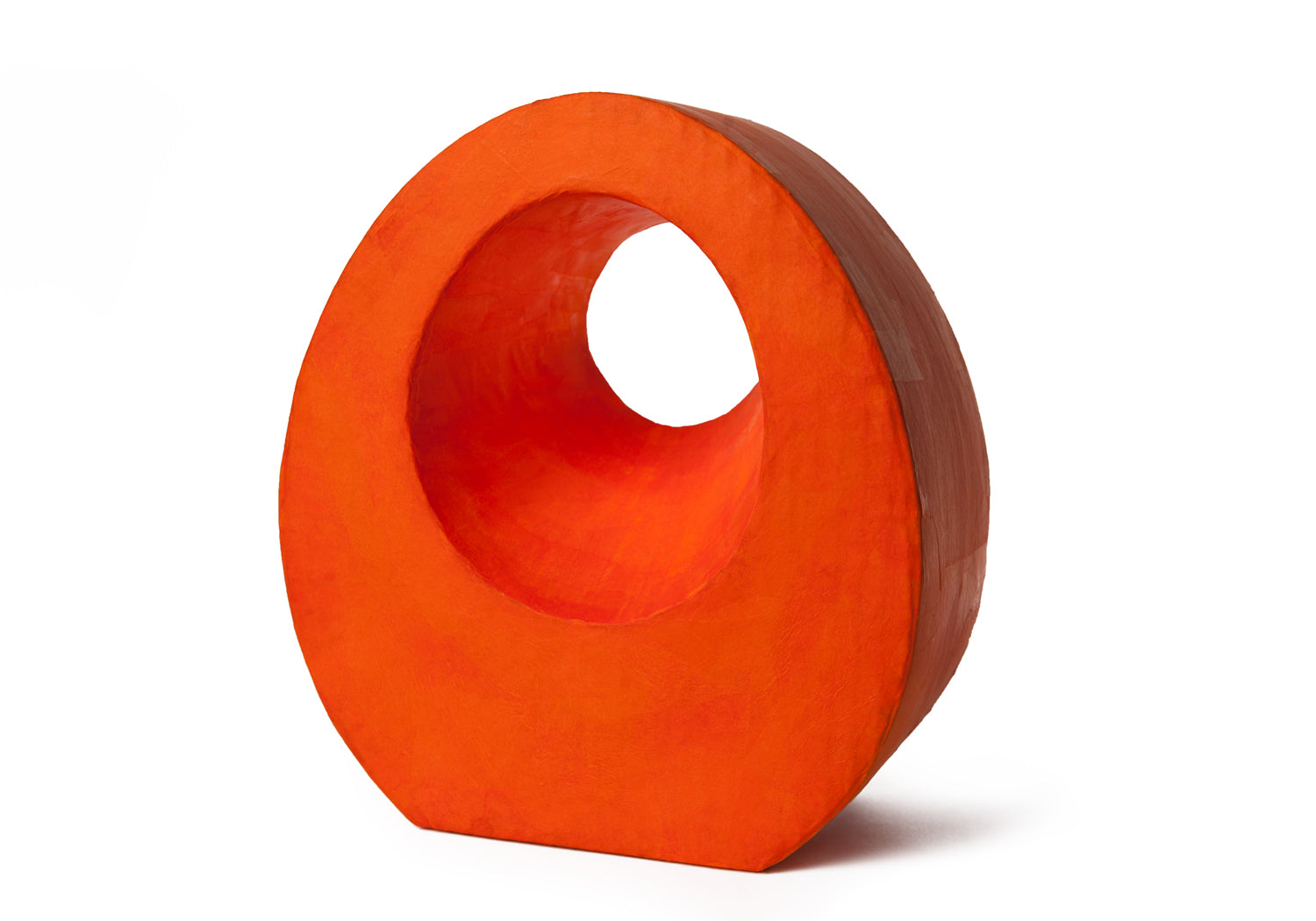 Picture of a beautiful orange tear drop shaped biodegradable paper cremation urn on sale at Muses Design Urns. Right side view.