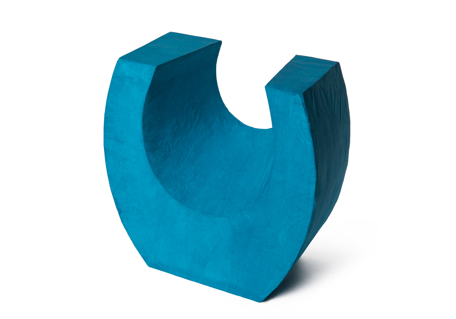 Picture of a beautiful aqua horseshoe shaped biodegradable paper cremation urn on sale at Muses Design Urns. Left side view.