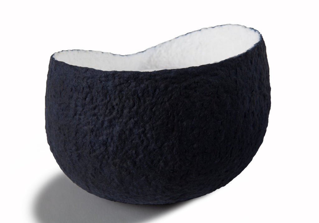 Picture of a white and blue ovoid shaped biodegradable cremation urn for pets on sale at Muses Design Urns. Back view.