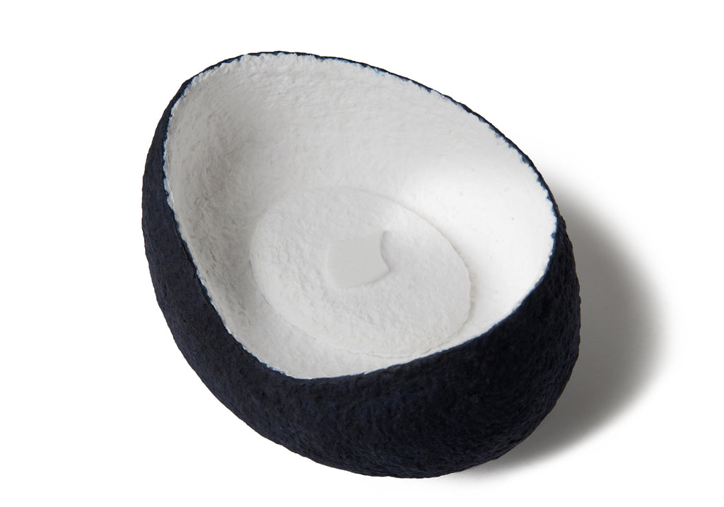 Picture of a white and blue ovoid shaped biodegradable cremation urn for dogs on sale at Muses Design Urns. Top view.