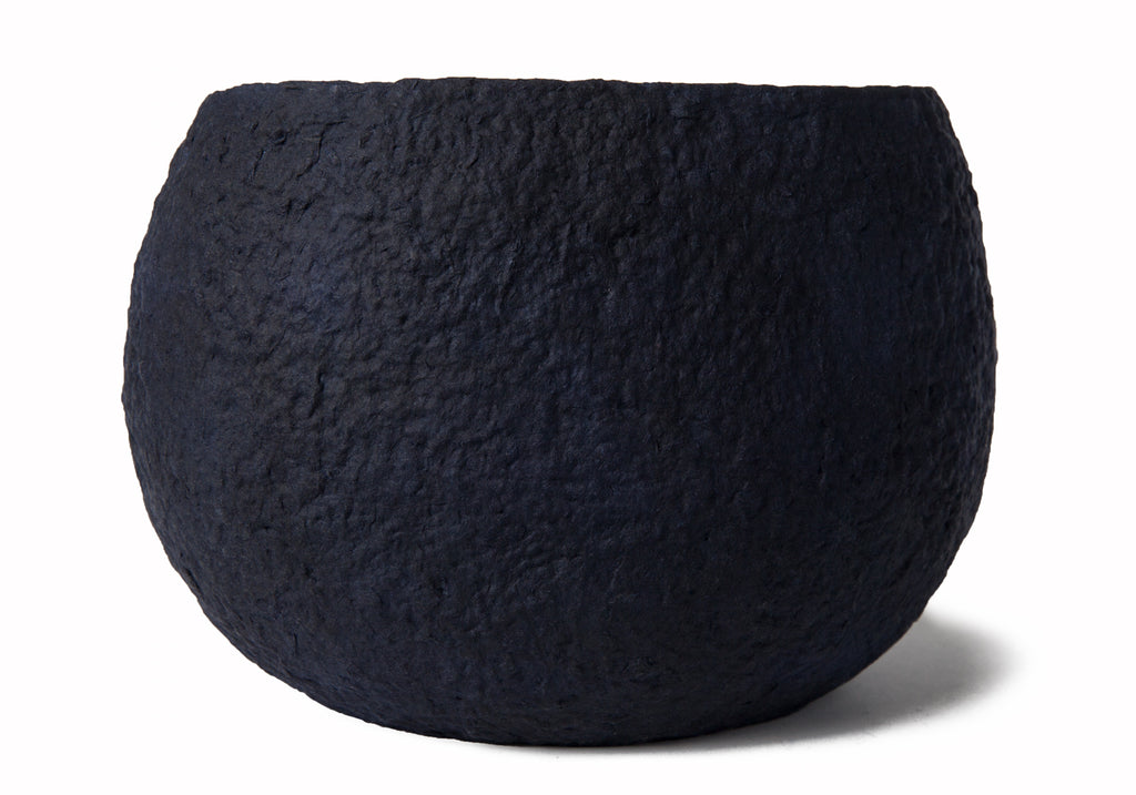 Picture of a white and blue ovoid shaped biodegradable cremation urn for dogs on sale at Muses Design Urns. Back view.