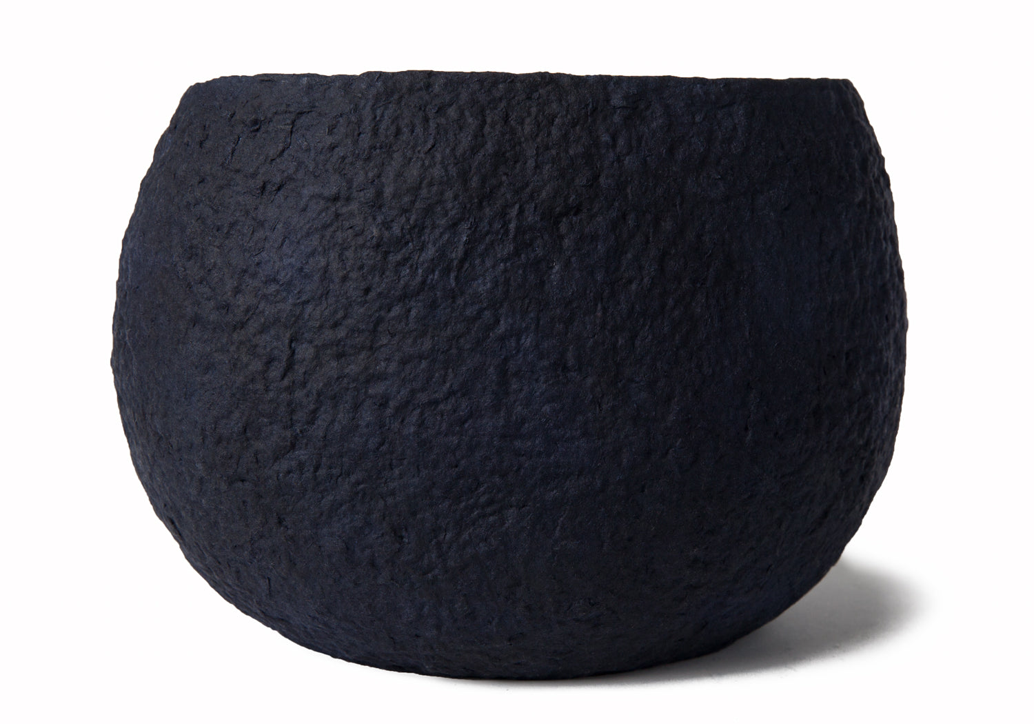Picture of a white and blue ovoid shaped biodegradable cremation urn for dogs on sale at Muses Design Urns. Back view.