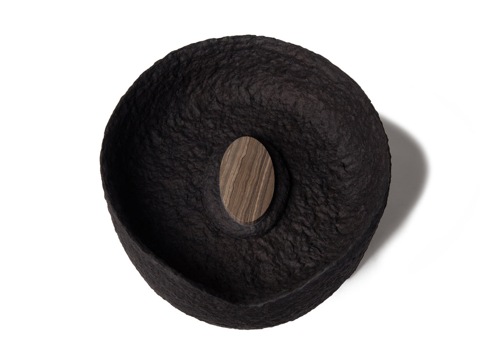 Picture of a black ovoid biodegradable cremation urn on sale at Muses Design Urns. Top view.