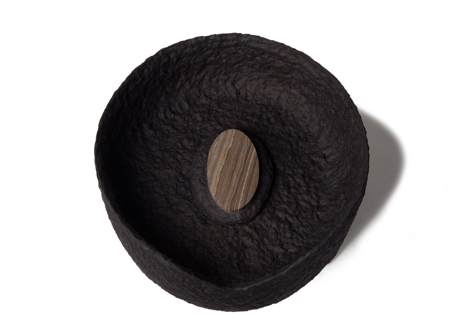 Picture of a black ovoid biodegradable cremation urn on sale at Muses Design Urns. Top view.