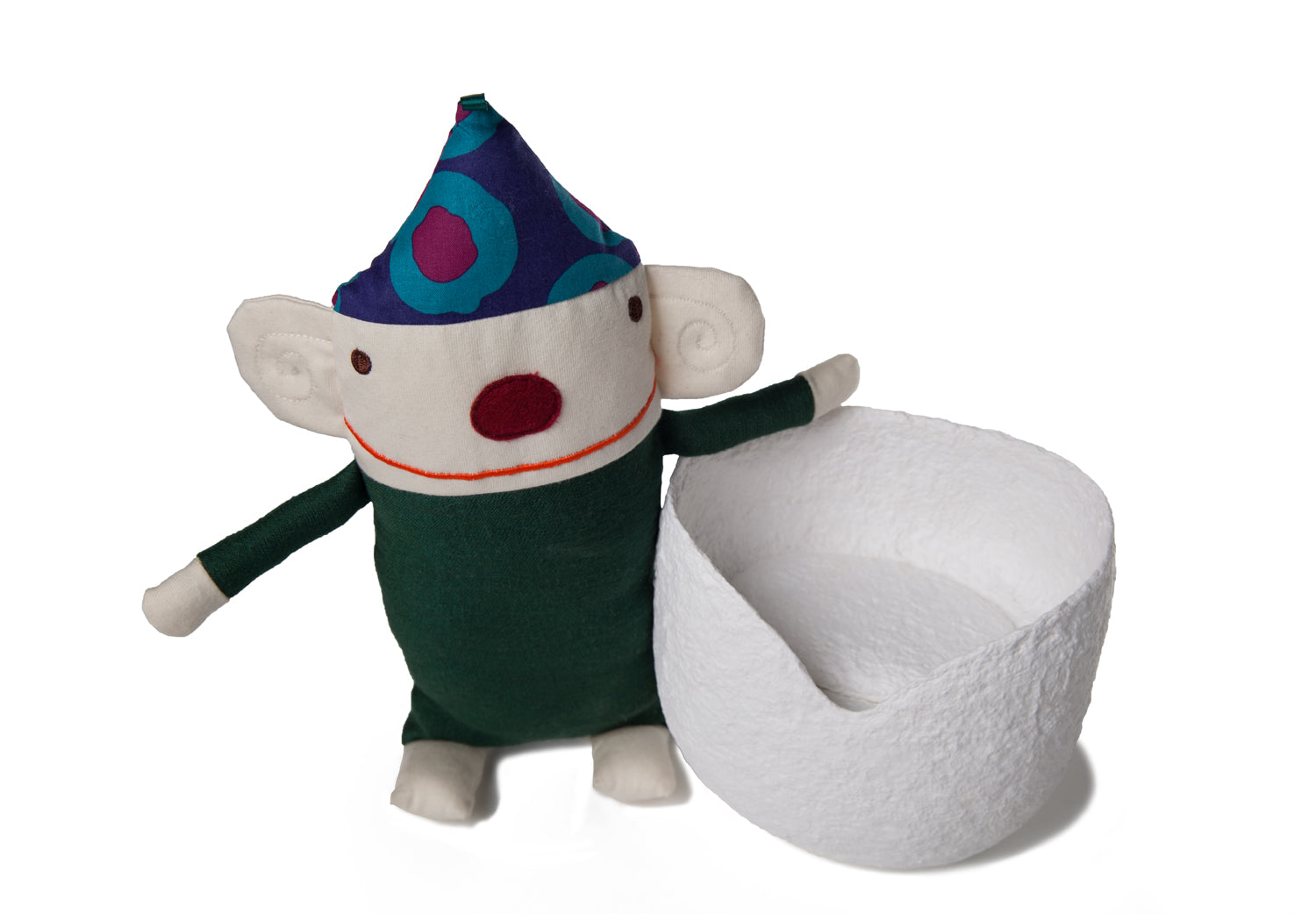 Picture of a white biodegrdable coton fibre cremation urn resembling a Moses basket for children on sale at Muses Design Urns. View with Raplapla doll.