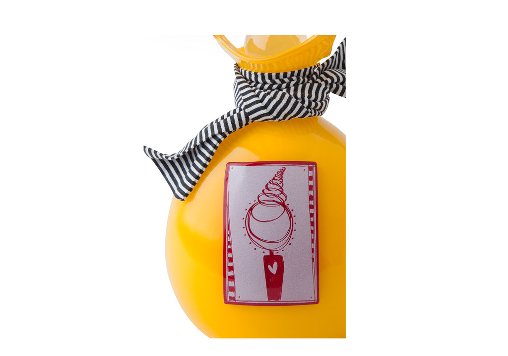 Picture of a bright yellow blown glass handkerchief wrapped ball cremation urn for children on sale at Muses Design Urns. Top view.
