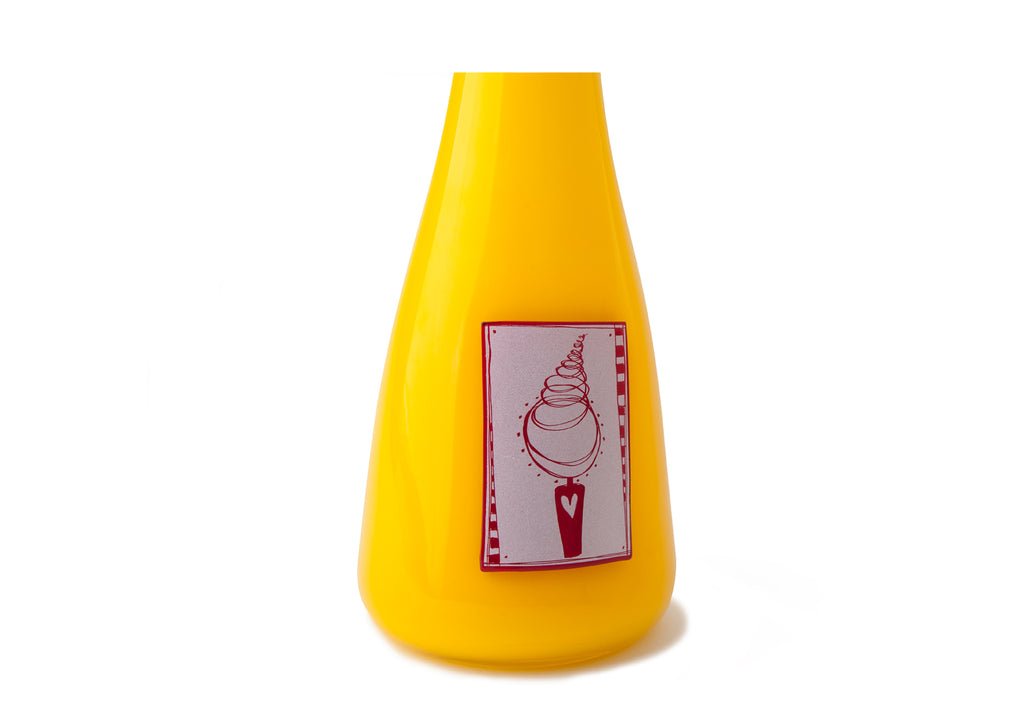 Picture of a bright yellow blown glass vase cremation urn for children on sale at Muses Design Urns. Close-up view.
